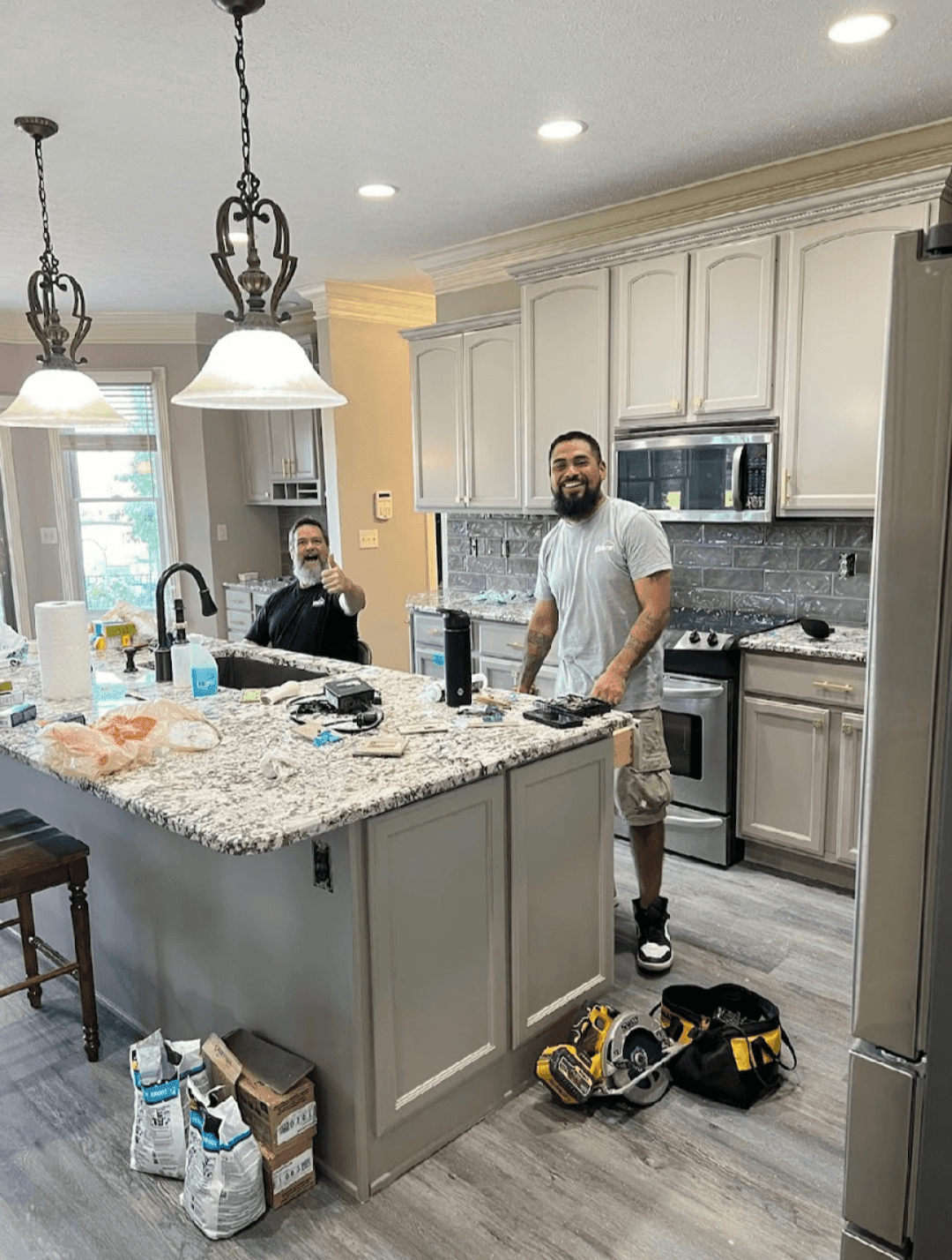 2 employees from Blaze renovations in the kitchen